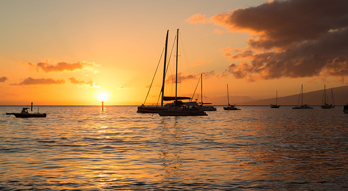 Sunset and boat off West Maui